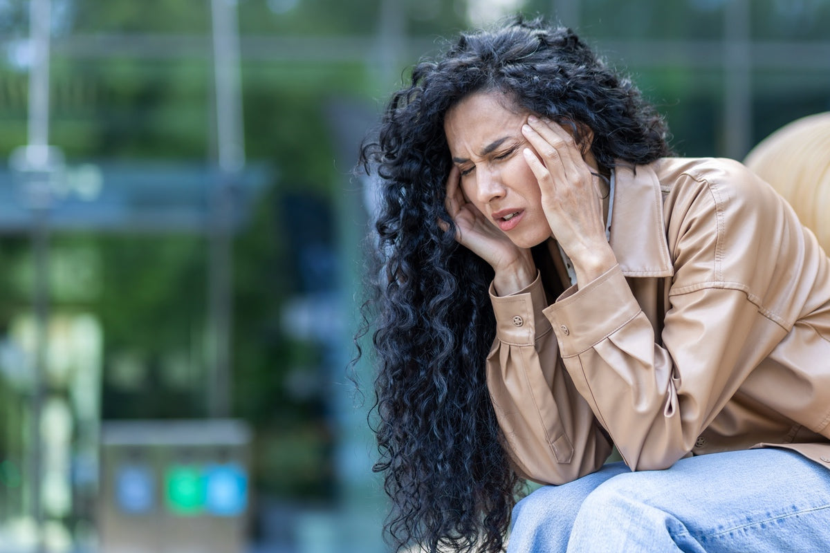 Person experiencing anxiety attack before using CBD product to find relief